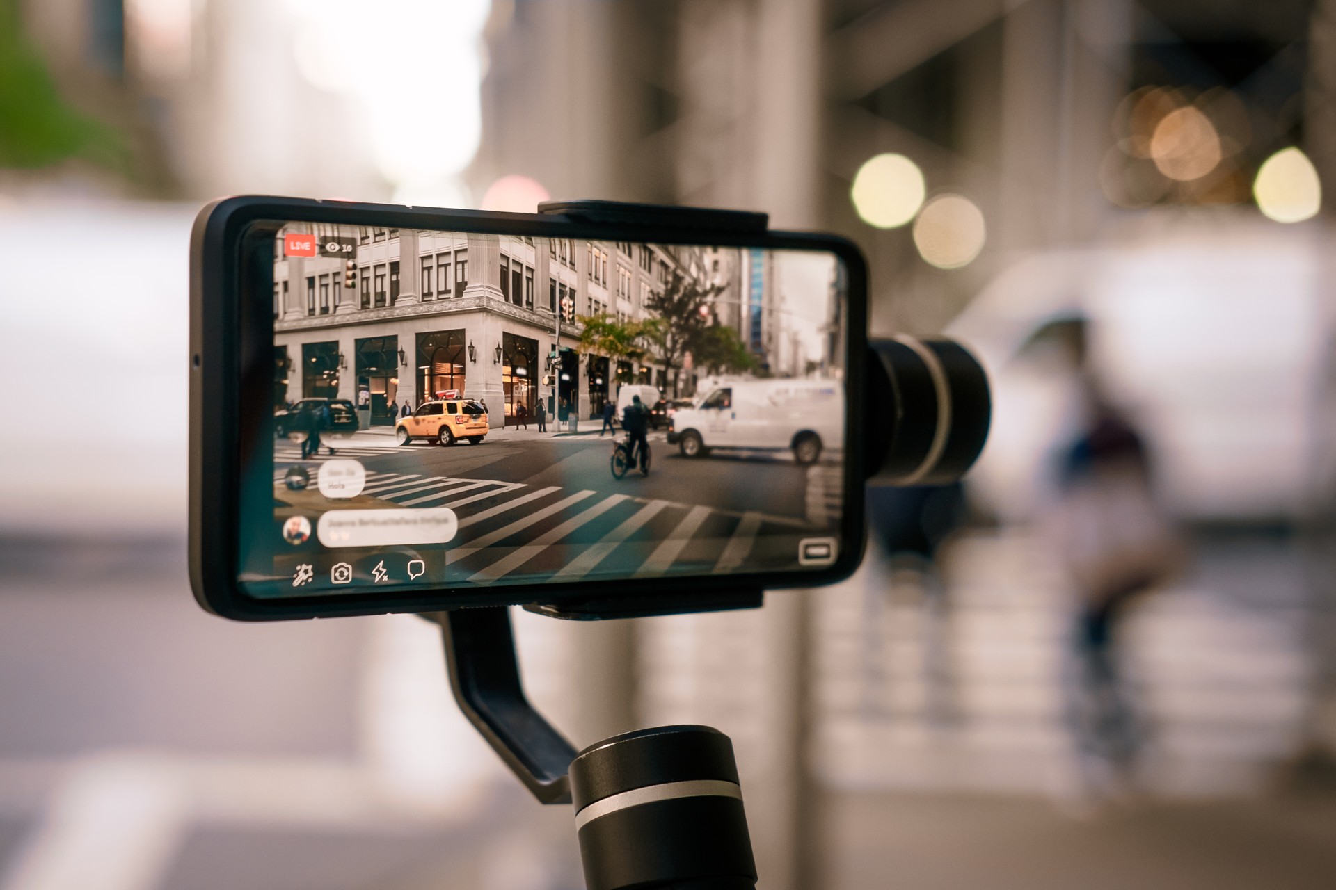 Man doing live video with phone with stabilizer  in NY